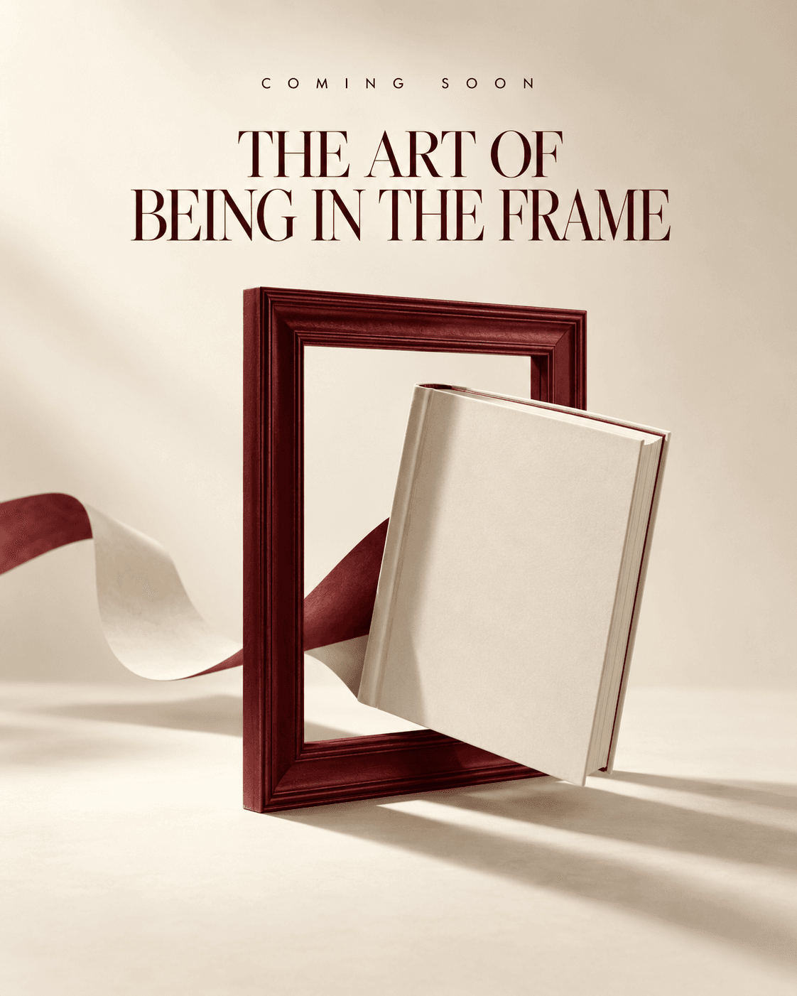 The Art of Being in the Frame — a book resting inside a deep burgundy picture frame